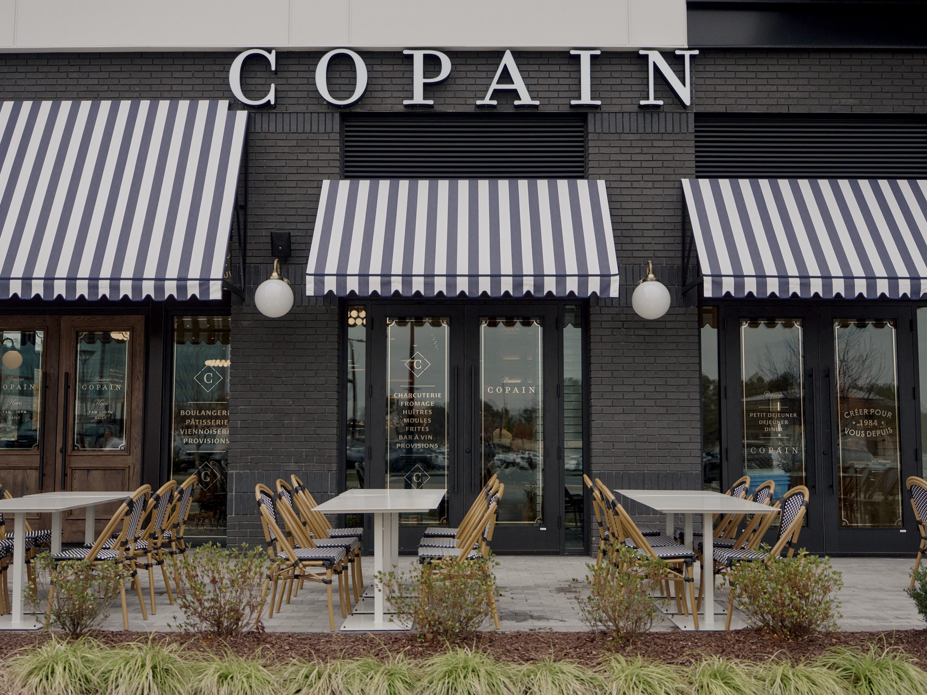Copain Ballantyne facade with striped awnings
